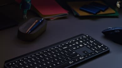 MX keys for business in a low light environment with illuminating keys